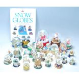 A large collection of 25+ original vintage collectable glass and plastic snow globes to include, The