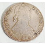 An 1810 Fernando VII 8 Reales silver coin – Ferdin VII Dei Gratia 1810 – translates Fernando the 7th