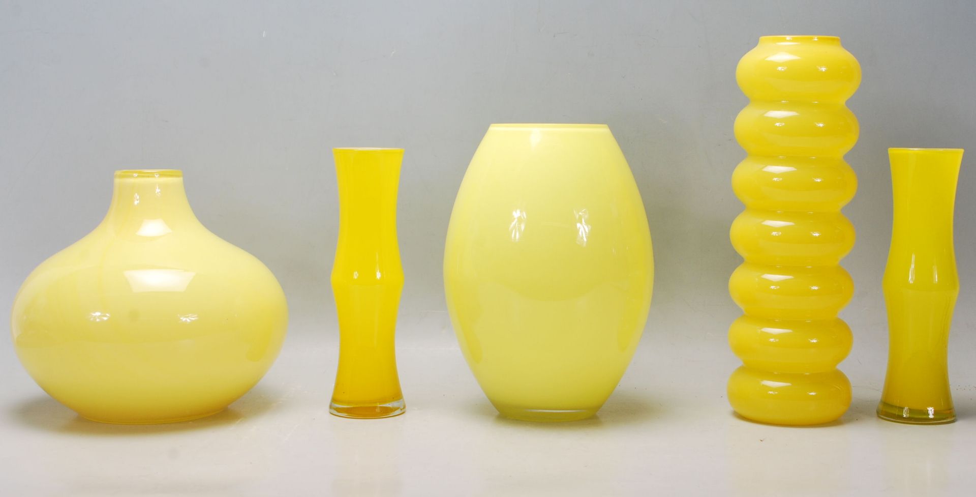 A mixed collection of retro vintage late 20th Century studio art glass ware in canary yellow to