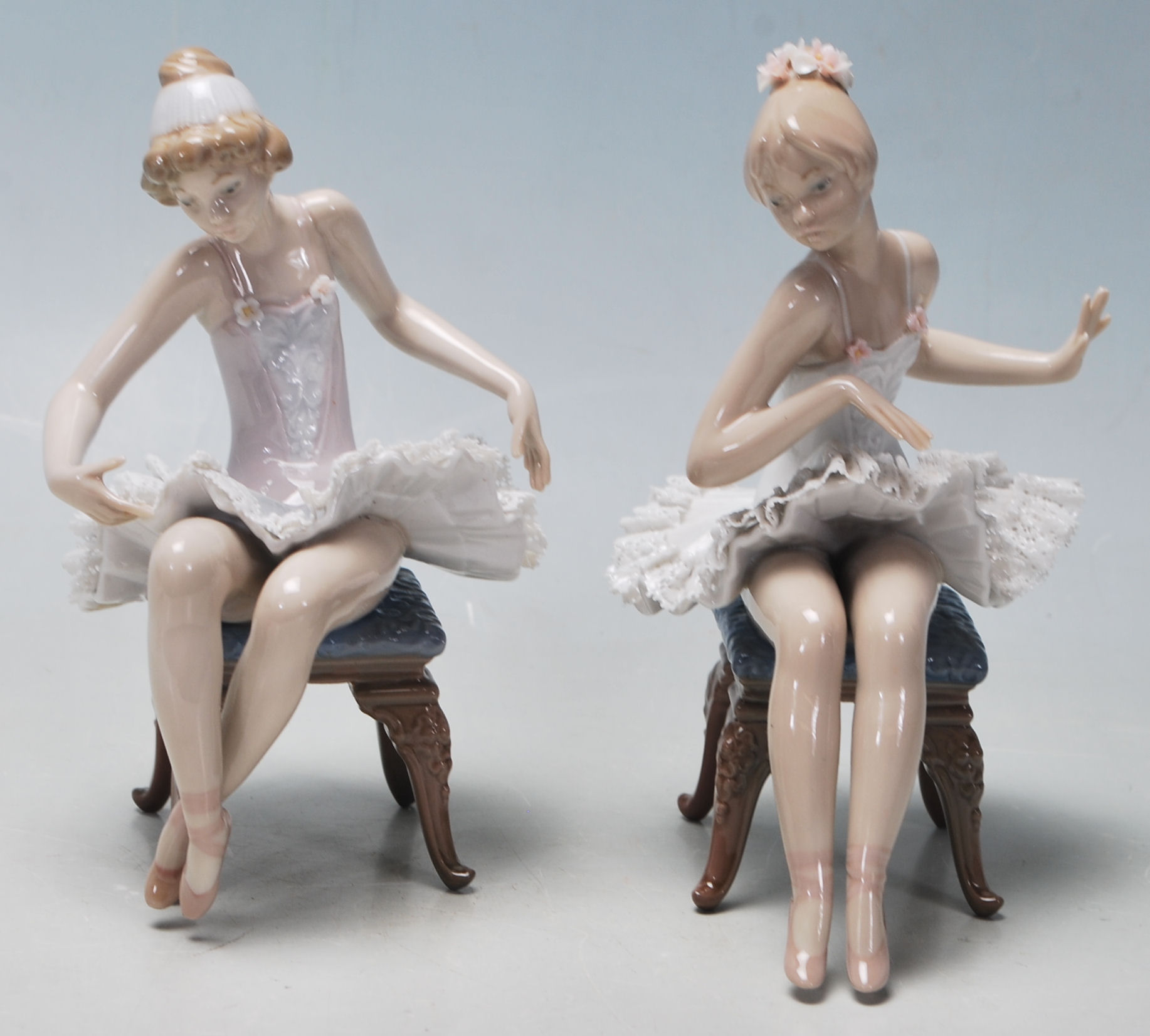 LLadro - A pair of late 20th Century vintage ceramic ballerinas comprising two seated girls getting