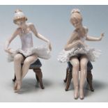 LLadro - A pair of late 20th Century vintage ceramic ballerinas comprising two seated girls getting