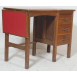 A retro vintage 1950s mid century air ministry style oak writing table / desk having a red formica