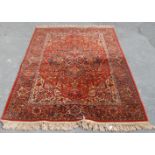 A 20th century Persian / Islamic Mashad Iranian floor rug having a central red ground with single
