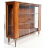 A retro vintage 1960s teak wood china display vitrine bookcase cabinet having glazed double doors