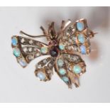 A 19th Century Victorian gem set butterfly insect bug brooch the wings being set with opal