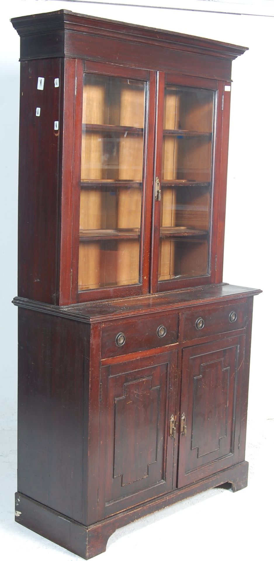 A Victorian 19th century oak library bookcase cabinet. The bookcase raised on plinth base with