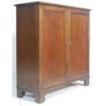 A Victorian 19thcentury mahogany estate cupboard – library bookcase cabinet. Raised on plinth base