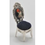 A silver 925 pin cushion in the form of a Thomas Chippendale chair having blue baize cushion to