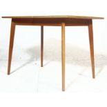 MID CENTURY TEAK AND FORMICA TOPPED DINING TABLE
