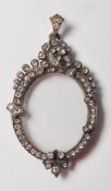 A late 19th / early 20th Century silver pendant lo