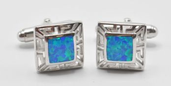 A pair of 925 silver and opal set cufflinks having