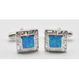 A pair of 925 silver and opal set cufflinks having