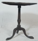 A George III 19th century country oak tilt top win