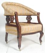 An Edwardian mahogany ebonised tub armchair - chai