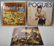 A collection of three vintage vinyl records by The