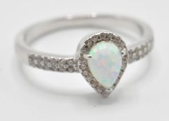 A stamped 925 silver ring having a central opal st