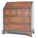 A 19TH CENTURY GEORGIAN WALNUT BUREAU WITH FITED INTERIOR