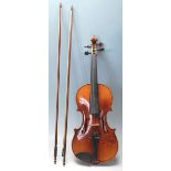 An antique early 20th Century 3/4 size violin by Nicholas Amatus. Made in Czechoslovakia. Comes with