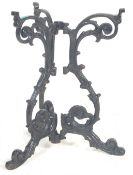AN ANTIQUE 20TH CENTURY CAST IRON THREE POINTS TABLE BASE.