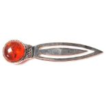 A STERLING SILVER BOOKMARK WITH AN AMBER STYLE STONE TO THE FINIAL.