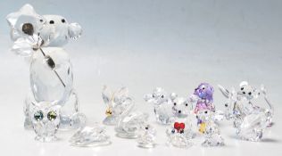 A selection of thirteen Swarovski crystal cut animal glass figurines to include a large teddy