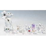 A selection of thirteen Swarovski crystal cut animal glass figurines to include a large teddy