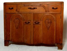 A vintage 1930's Art Deco oak dresser - sideboard having three short drawers over two cupboards at