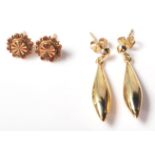 Two pairs of hallmarked 9ct gold earrings. One having flower head along with a teardrop shaped 375