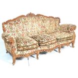 Louis XVI style French mahogany pointed canape sofa. The sofa having wooden carved scroll decoration