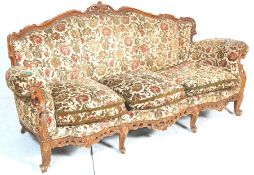 Louis XVI style French mahogany pointed canape sofa. The sofa having wooden carved scroll decoration