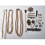 A group of silver, white metal, yellow metal and gold plated costume jewellery to include two