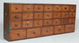 ANTIQUE OAK AND MAHOGANY APOTHECARY BANK OF DRAWERS