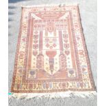 An early 20th century antique hand waved Persian orientalist Middle East prayer rug with typical