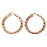 A pair of 9ct gold hallmarked earrings / hoop earrings with twisted design and 375 marks on the