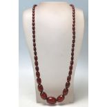 An early 20th Century bakelite beaded necklace having oval graduating beads. Measures 31 inches.