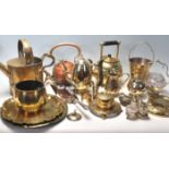A collection of late 20th century brass ware items to include teapot, chargers, candlesticks,