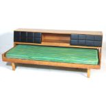 A unusual retro 1970’s oak veneer G Plan bed. The bed has a headboard / blanket box above the bed