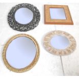 A group of four vintage 20th century wall hanging mirrors comprising of a hand carved pierced