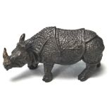 AN UNUSUAL BRONZE THIMBLE POT IN THE FORM OF A RHINOCEROS