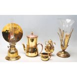 A quantity of vintage 20th century brassware to include lamps, steam vase with brass base and