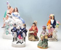 A group of five 19th century Victorian Staffordshire flat back ceramic figurines to include