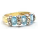 18CT GOLD BLUE STONE DRESS RING