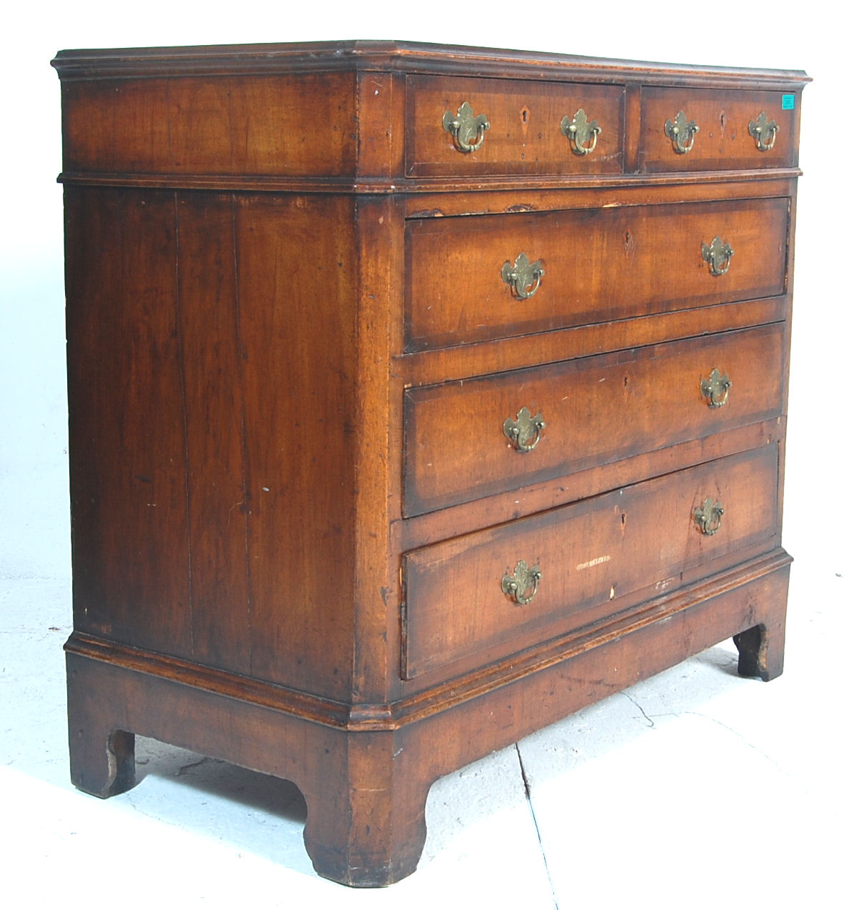 An early 19th century Georgian mahogany chest of drawers having two short drawers over three full