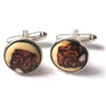 A PAIR OF SILVER CIRCULAR CUFFLINKS WITH ENAMEL PANELS DEPICTING DOGS.
