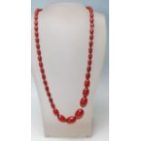 AN ANTIQUE CHERRY AMBER NECKLACE