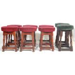 A SET OF EIGHT ANTIQUE STYLE OAK PUB STOOLS.