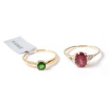 A pair of Gemporia hallmarked 9ct gold rings. A Mahenge Garnet and Diamond 9K gold ring with oval