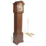 AN ANTIQUE DARK OAK LONGCASE CLOCK.