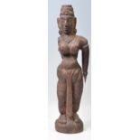An antique Western Indian hand carved wooden tribal figurine of semi-nude goodness female with