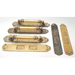 A set of three industrial salvage 20th century Art Deco style brass door handles and kicks plates